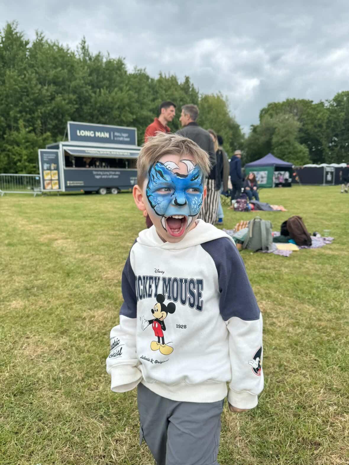 Blue monster face paint design for boys