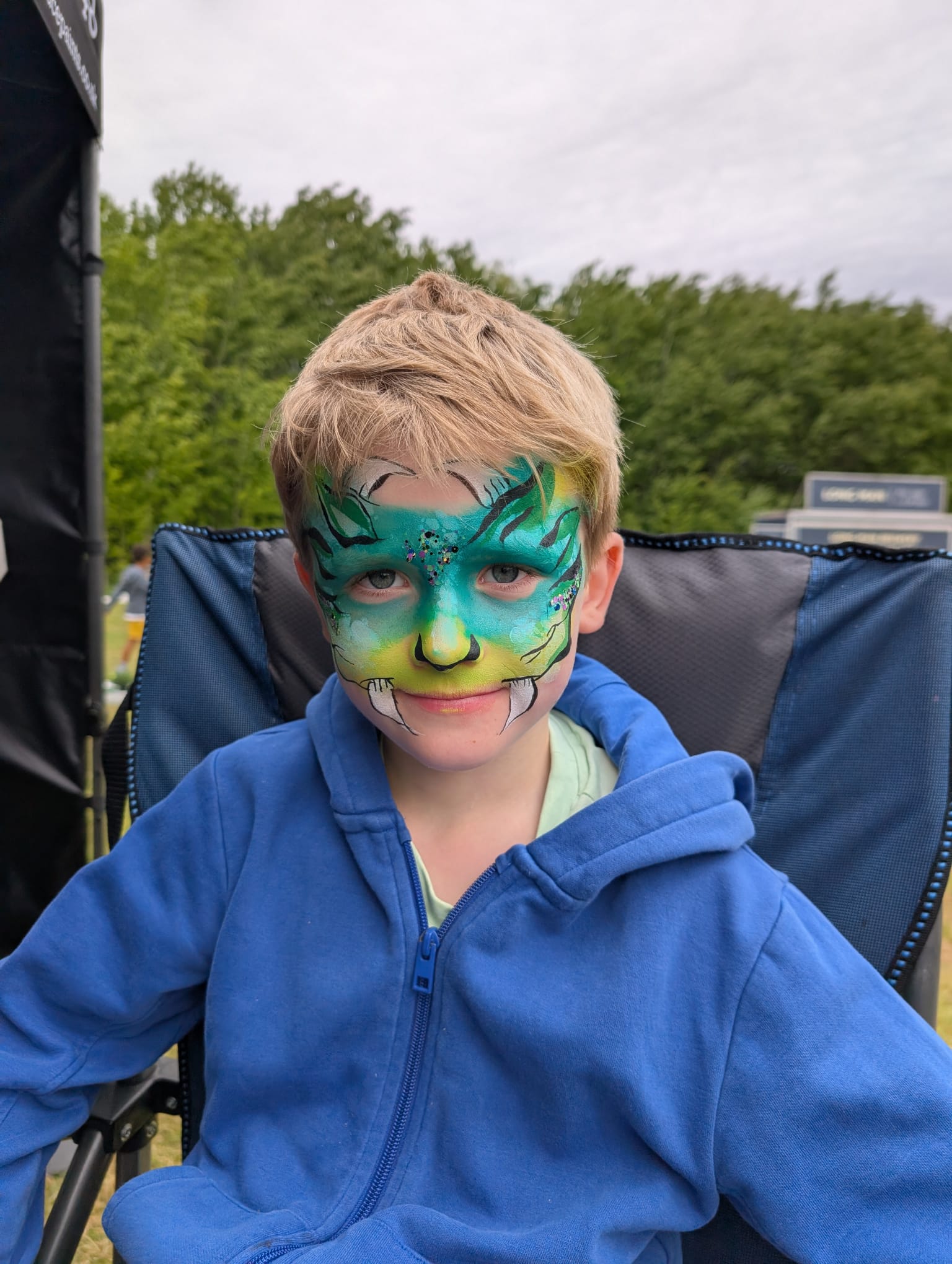 Colourful face painting design for a party guest in Sussex