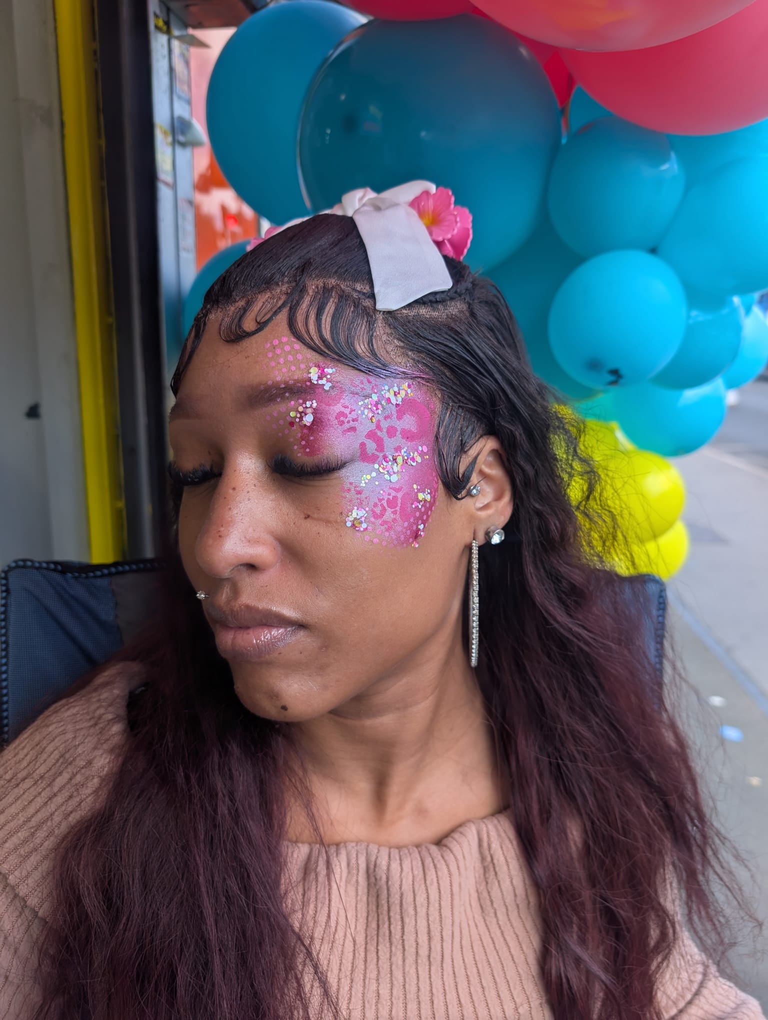 Pink leopard print face paint design