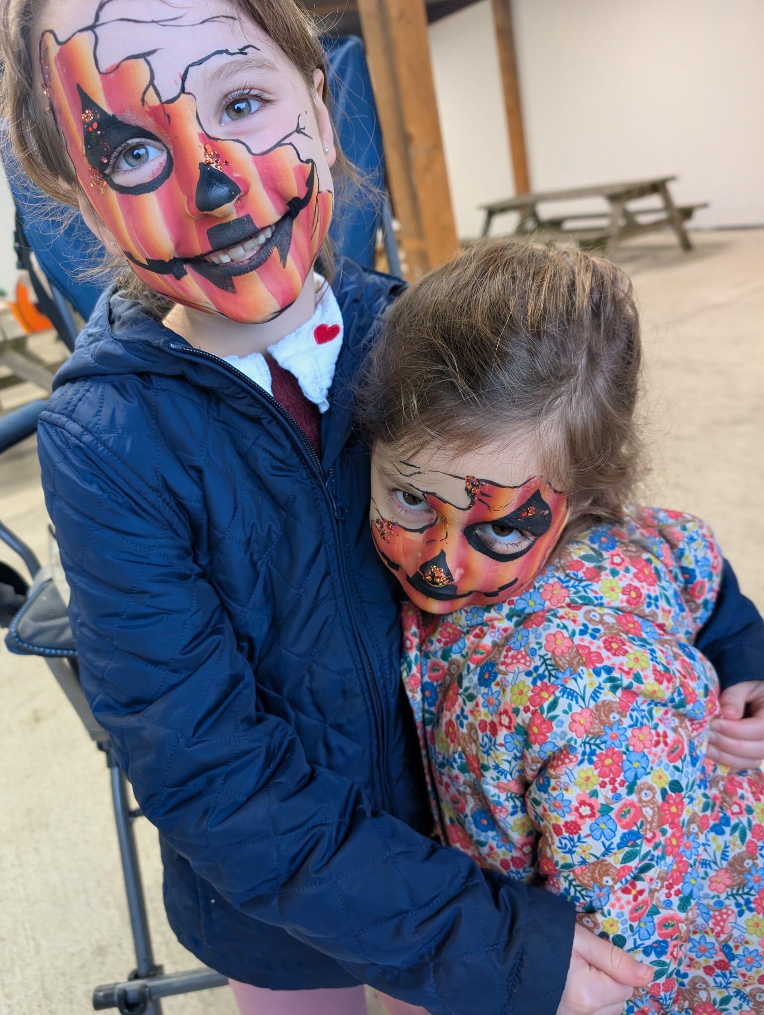 Pumpkin face paint for sisters