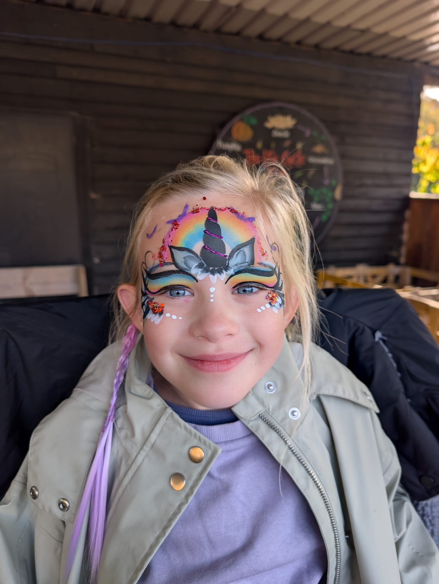 Rainbow unicorn face paint for a girl