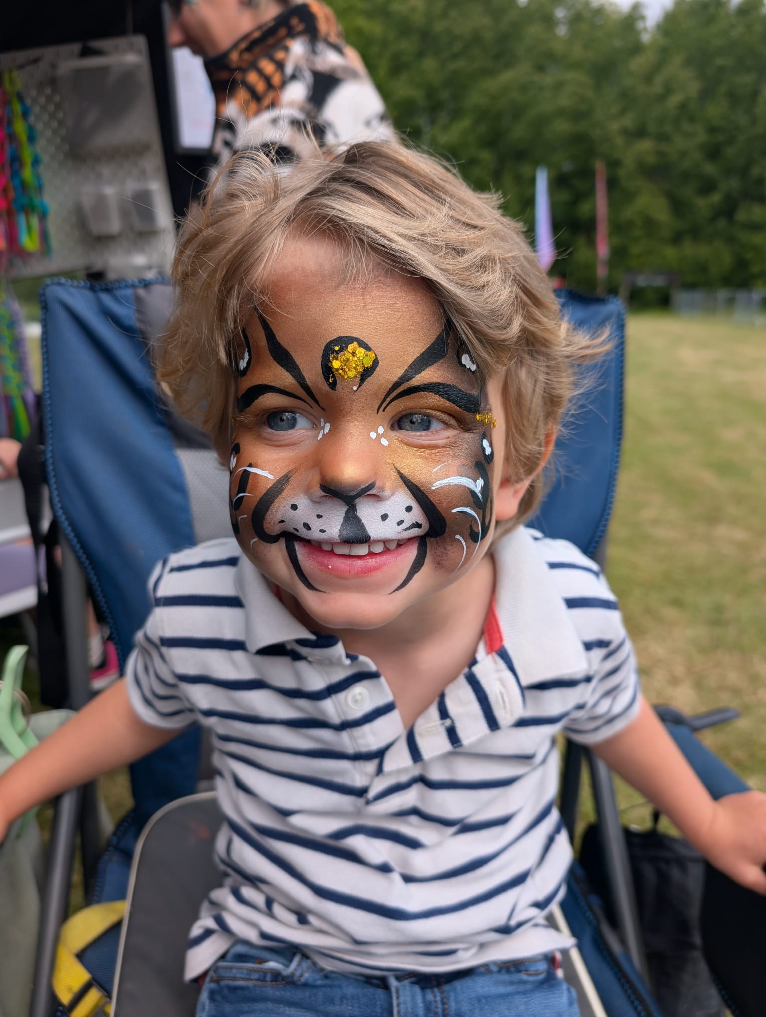 Colourful face painting design for a party guest in Sussex