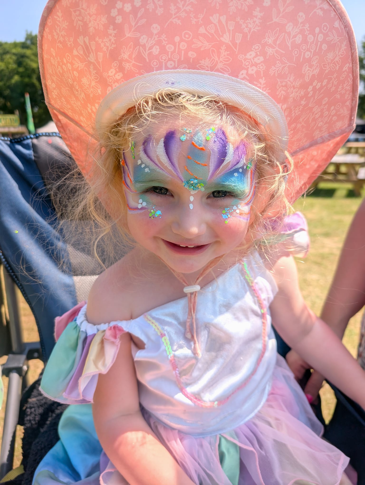 Blue-themed creative face painting design by The Painting Pixie
