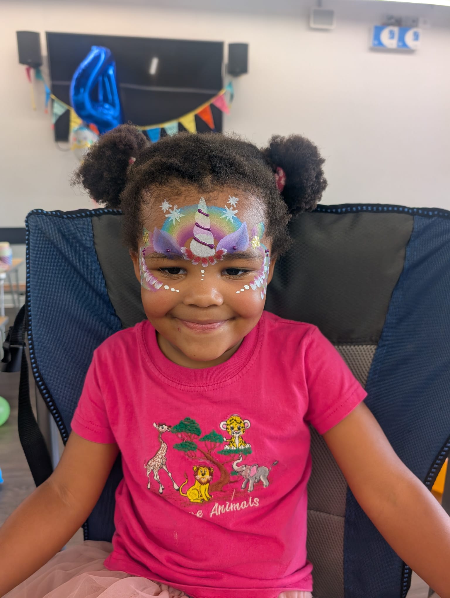 Unicorn rainbow face paint for a girl