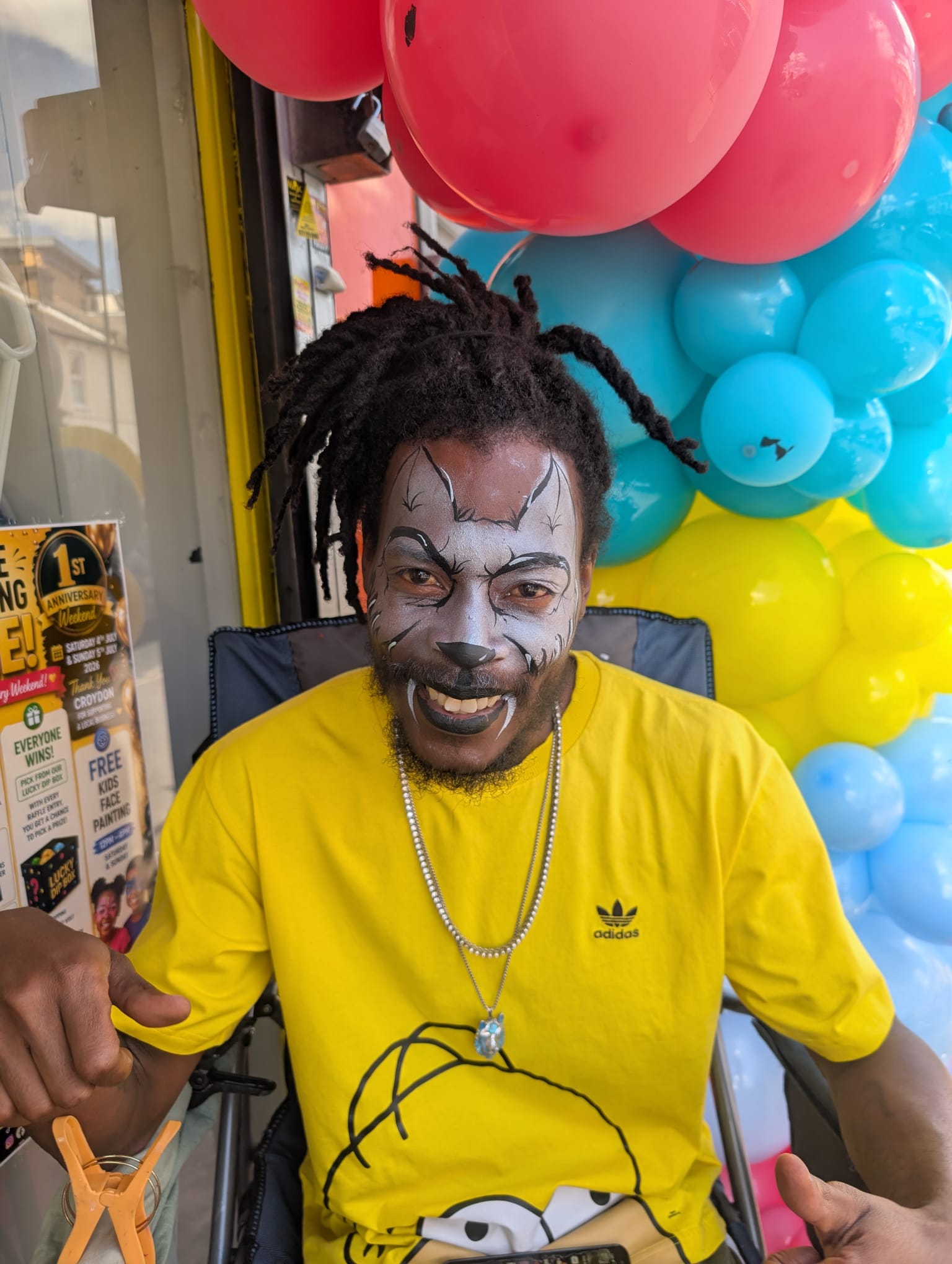 Colourful face painting design for a party guest in Sussex